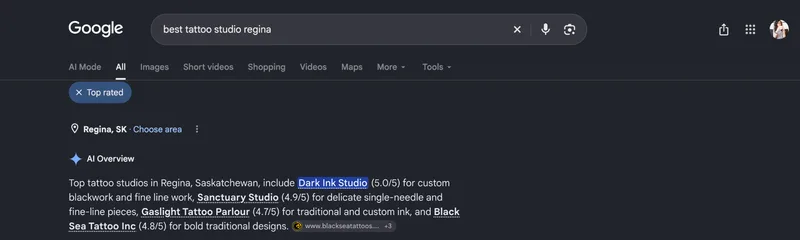 Google search for "best tattoo studio regina." The AI Overview names Black Sea Tattoo among four top studios and cites blackseatattoos.com as a source.